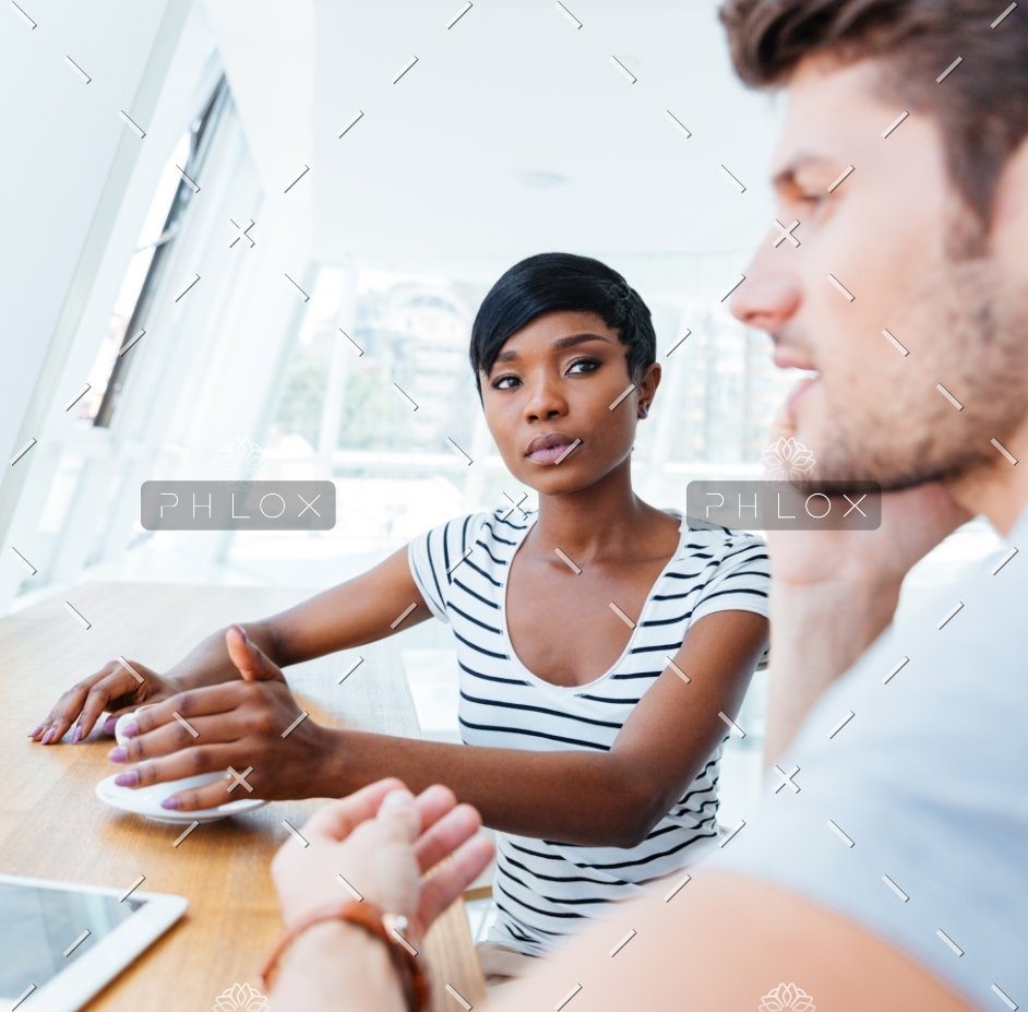 demo-attachment-307-Businesswoman-and-smiling-businessman-discussing-work-in-restaurant@2x